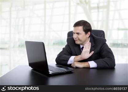 young businessman working with is laptop at the office