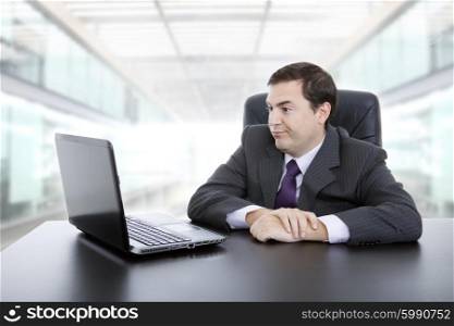 young businessman working with is laptop, at the office