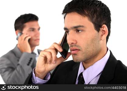 Young businessmen on the phone
