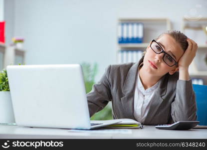 Young businesswoman accountant working in the office