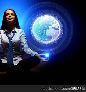 Young businesswoman against blue global technology background