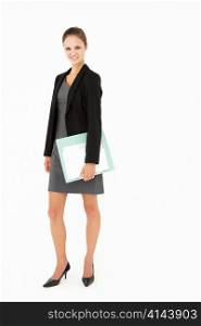 Young businesswoman carrying folder