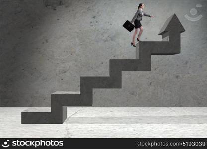 Young businesswoman climbing career ladder