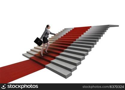 Young businesswoman climbing stairs and red carpet