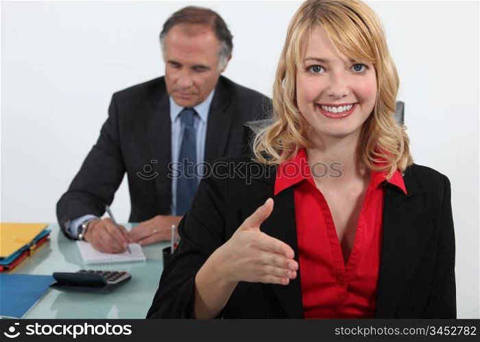 young businesswoman giving her hand for a handshake