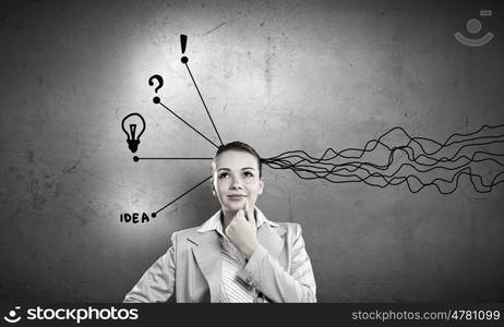 Young businesswoman has an idea. Young thoughtful woman and ideas coming out of her head