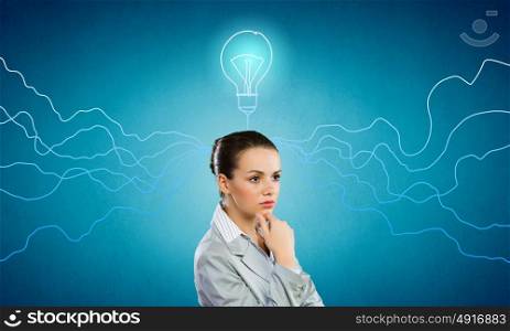Young businesswoman has an idea. Young thoughtful woman and ideas coming out of her head