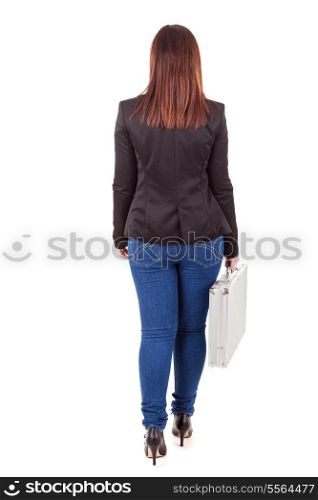 Young businesswoman, holding a suitcase, walking - full body