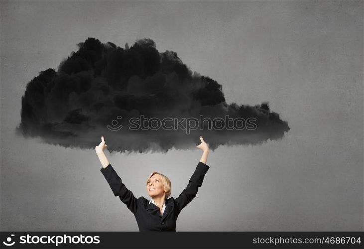 Young businesswoman holding black cloud above head. Woman hold cloud