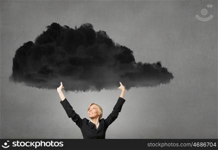 Young businesswoman holding black cloud above head. Woman hold cloud