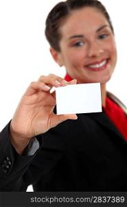young businesswoman holding business card