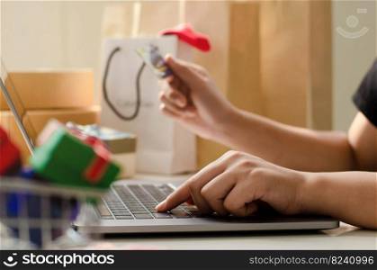 young businesswoman holding credit card and typing on laptop for online shopping Ready to pay online, make purchases on the Internet. online payment business finance and technology
