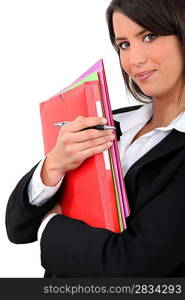 Young businesswoman holding folders