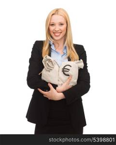 young businesswoman holding money bags with euro