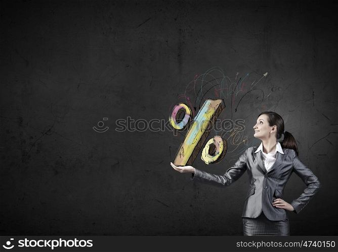 Young businesswoman holding percentage symbol in palm. Sales and percentage