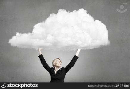 Young businesswoman holding white cloud above head. Woman hold cloud