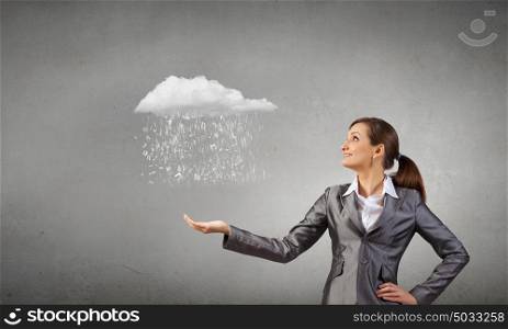 Young businesswoman holding white cloud in hands. Woman hold cloud