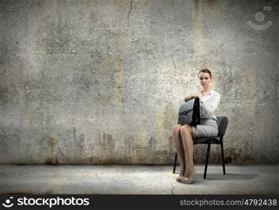 Young businesswoman. Image of young businesswoman sitting on chair