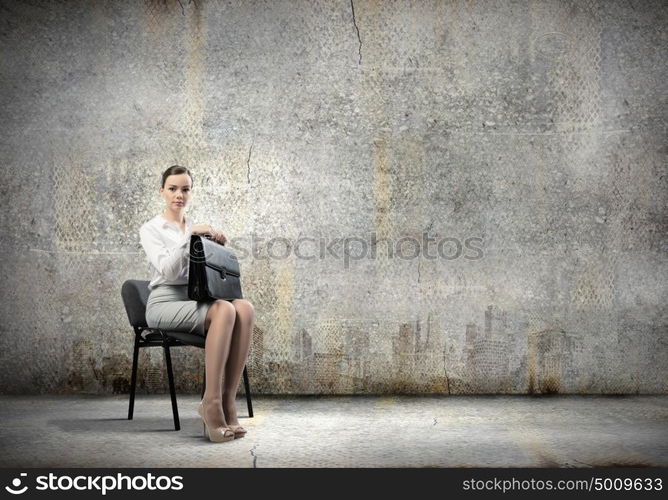 Young businesswoman. Image of young businesswoman sitting on chair