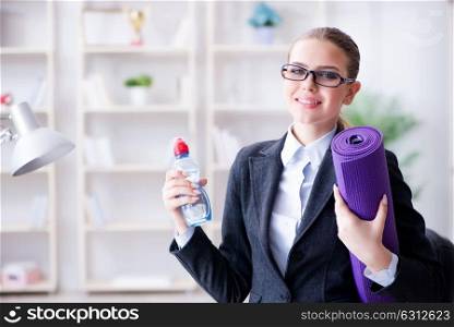 Young businesswoman in healthy lifestyle concept. The young businesswoman in healthy lifestyle concept