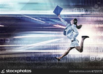 Young businesswoman in suit running at full pelt. Full speed businesswoman