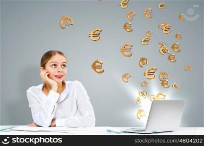 Young businesswoman in the office with money banknotes around her