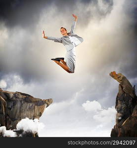 Young businesswoman jumping