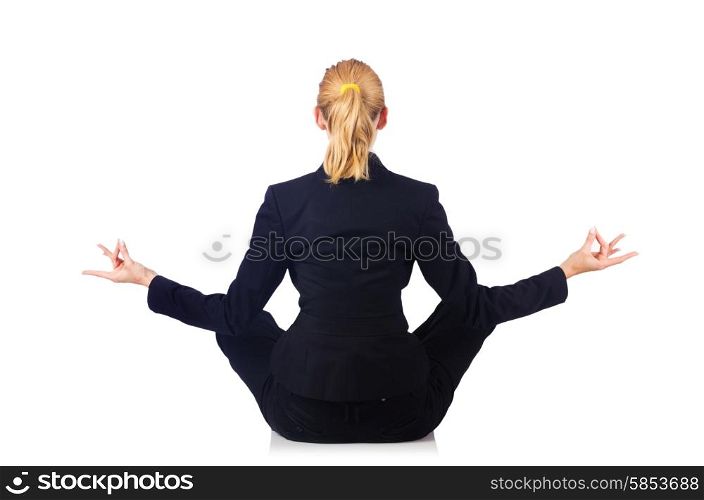 Young businesswoman meditating on the white