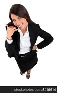 Young businesswoman mobile telephone gesture with hand