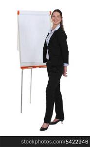 young businesswoman near paperboard during meeting