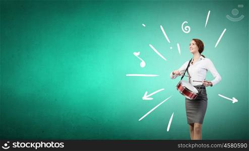 Young businesswoman on color background playing drum. Businesswoman with drum