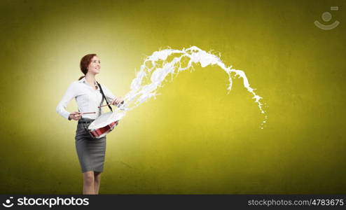 Young businesswoman on color background playing drum. Businesswoman with drum