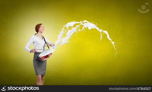 Young businesswoman on color background playing drum. Businesswoman with drum