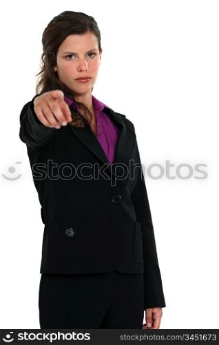 young businesswoman pointing at someone in front of her