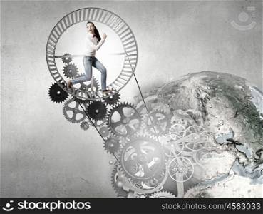 Young businesswoman running in wheel of gears mechanism. Elements of this image are furnished by NASA. To turn as squirrel in wheel