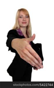 Young businesswoman shaking hands