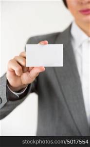 Young businesswoman showing her blank business card