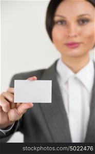 Young businesswoman showing her blank business card