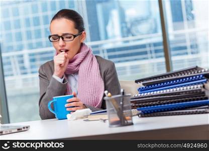 Young businesswoman sick in the office