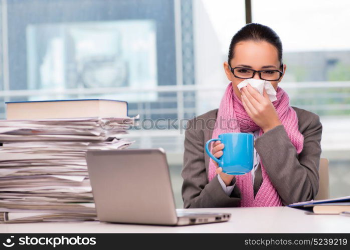 Young businesswoman sick in the office