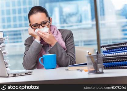 Young businesswoman sick in the office