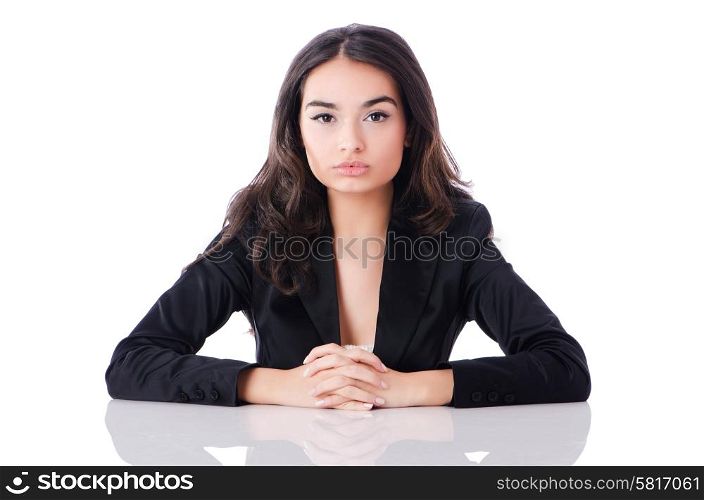 Young businesswoman sitting at desk on white