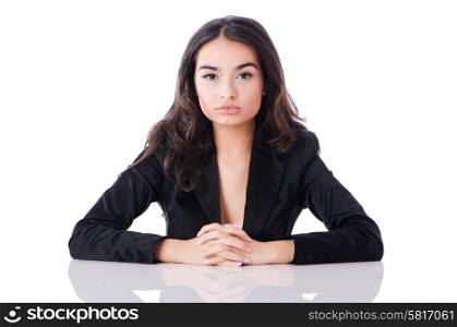Young businesswoman sitting at desk on white