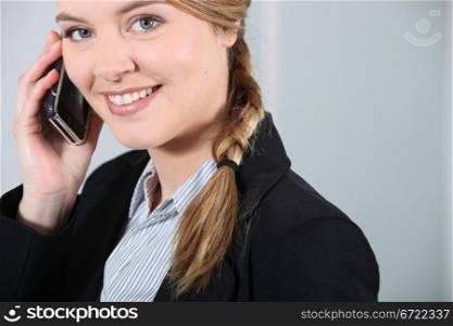 Young businesswoman smiling on the phone.