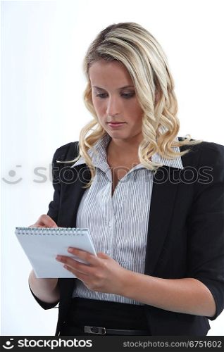 young businesswoman taking notes