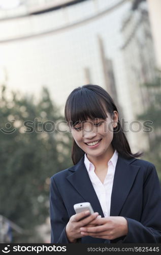 Young Businesswoman texting a message