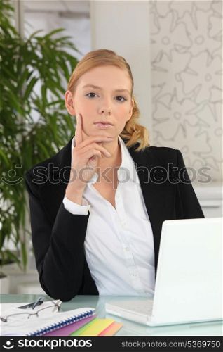Young businesswoman using a laptop computer at her desk