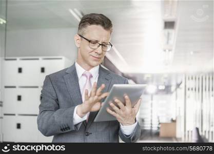 Young businesswoman using copy machine in office