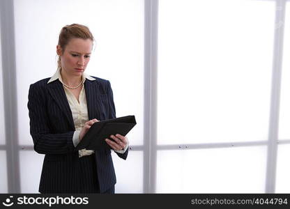 Young businesswoman using digital tablet