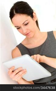 Young businesswoman using electronic tablet